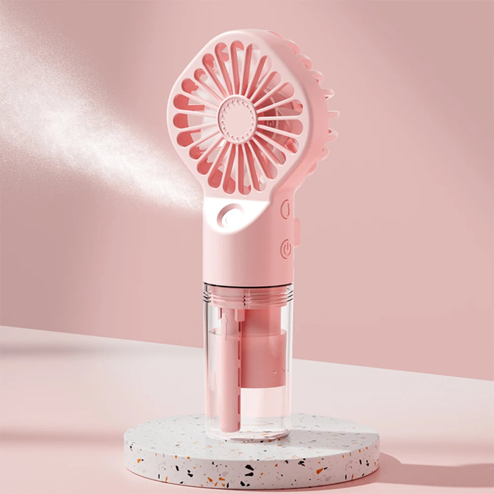 Ventilador portátil con pulverizador de agua 2 en 1 Mini ventilador de mano recargable por USB con función humidificadora y spray refrescante.